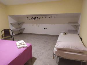 Ein Bett oder Betten in einem Zimmer der Unterkunft Appartamento Margherita