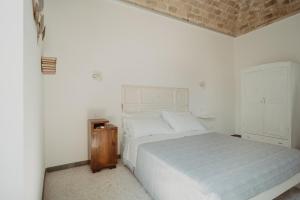 Postel nebo postele na pokoji v ubytování La Torre Vasto B&B
