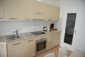 A kitchen or kitchenette at Appartamento Laura