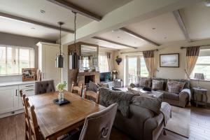 a living room with a table and a couch at Esk View in Whitby
