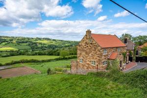 a large brick house on a grassy hill at Esk View in Whitby