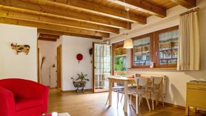 a kitchen and dining room with a table and chairs at Haus Miriam in Münstertal