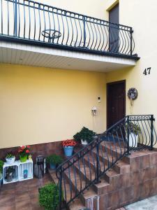 a staircase in a house with potted plants at Pokoje gościnne Zofia Narloch in Władysławowo