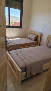 Кровать или кровати в номере Apartamentos Khalifa B2 +3 фотографии