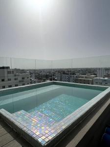 a swimming pool on the roof of a building at Downtown Santo Domingo Luxury Apartment in Santo Domingo