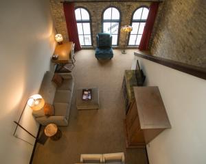 an overhead view of a living room with a staircase at Brewhouse Inn and Suites in Milwaukee