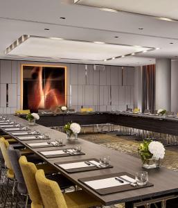 a conference room with a long table and chairs at Park Plaza Victoria Amsterdam in Amsterdam