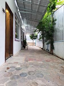 an empty hallway with a bench in a building at Nary Apartment in Siem Reap
