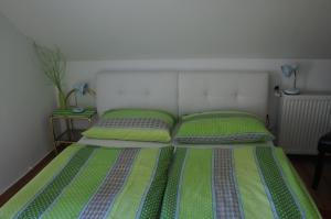 Postel nebo postele na pokoji v ubytování Apartments Mencinger