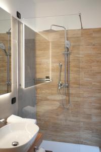 a bathroom with a shower and a sink at Re Di Cuori Hotel in Caianello +39 photos