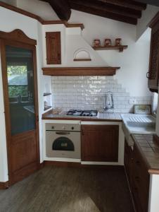 Kuchyň nebo kuchyňský kout v ubytování Casa Renacci