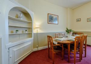 a dining room with a table and chairs at Grenville - Upcott House in Barnstaple