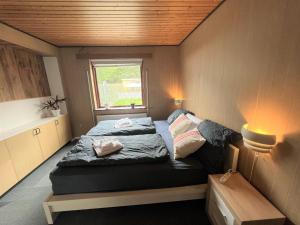 a bedroom with two beds and a window at The Yellow House, Beach 5mins Drive, 3BR with free parking, Fast Fiber Internet in Rødby