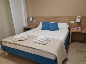 Postel nebo postele na pokoji v ubytování B&B Al Quadrato