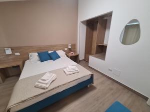 Postel nebo postele na pokoji v ubytování B&B Al Quadrato