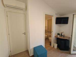 TV a/nebo společenská místnost v ubytování B&B Al Quadrato