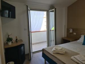Postel nebo postele na pokoji v ubytování B&B Al Quadrato