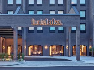 a hotel with a sign on the front of a building at Hotel AKA Alexandria in Alexandria