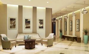 a waiting room with chairs and a table at Hilton Garden Inn Dubai Al Mina - Jumeirah in Dubai