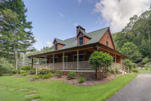a large wooden house with a green roof at 7 Mi to Beech Mountain Skiing Home with Fire Pit in Banner Elk