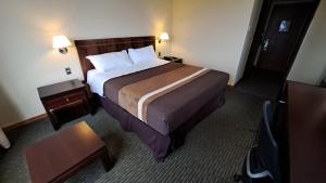 Ένα ή περισσότερα κρεβάτια σε δωμάτιο στο Hotel Diego de Almagro Temuco