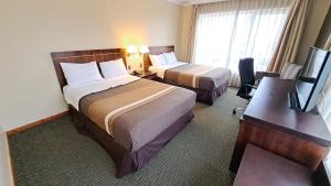 Ένα ή περισσότερα κρεβάτια σε δωμάτιο στο Hotel Diego de Almagro Temuco