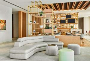 a living room with a couch and a table at Hilton Garden Inn Dubai, Mall Avenue in Dubai