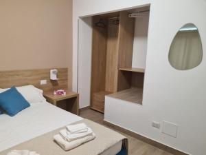 Postel nebo postele na pokoji v ubytování B&B Al Quadrato