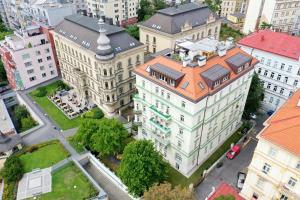 an overhead view of a large building with an orange roof at Luxury rooftop appartment with fantastic views in Prague