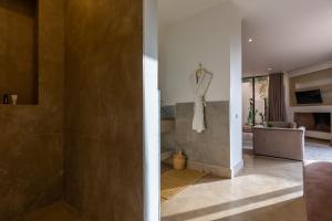 two images of a bathroom with a shower and a room at Villa Tomazo in Marrakech +61 photos