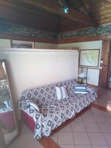 a bed with pillows in a room at 56s.m comftorable studio,airport area in Anemómylos