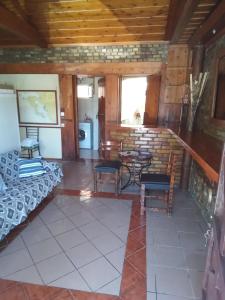 a room with a bed and a table and chairs at 56s.m comftorable studio,airport area in Anemómylos