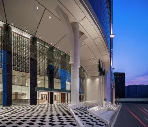 a large building with a black and white tiled floor at Doubletree By Hilton Makkah Jabal Omar in Makkah