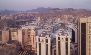 an aerial view of a city with tall buildings at Doubletree By Hilton Makkah Jabal Omar in Makkah