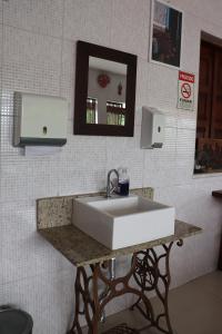 Ett badrum på Pousada Recôncavo
