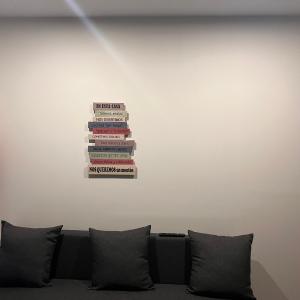 a stack of books sitting on top of a wall at APARTAMENTOS EL ROJU in Santillana del Mar