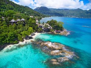 an aerial view of a tropical island in the ocean at Hilton Seychelles Northolme Resort & Spa in Beau Vallon