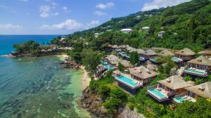 an aerial view of a resort next to the ocean at Hilton Seychelles Northolme Resort & Spa in Beau Vallon