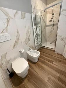 a bathroom with a toilet and a sink and a shower at HH Hermoso Housing ALESSANDRIA in Alessandria +103 photos