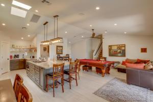 a kitchen and living room with a pool table at Stunning Phoenix Oasis with Golf Course Views! in Phoenix
