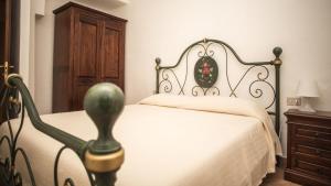 Postel nebo postele na pokoji v ubytování Agriturismo Podere Valdo