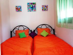 two beds sitting next to each other in a bedroom at Porto Katsiki Blu in Athani
