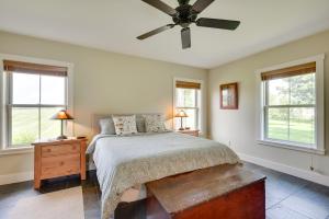 a bedroom with a bed and a ceiling fan at Hardwick Family Home on VAST Snowmobile Trail in Hardwick