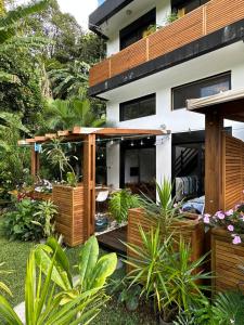 a house with a garden in front of it at O Verger in Saint-André