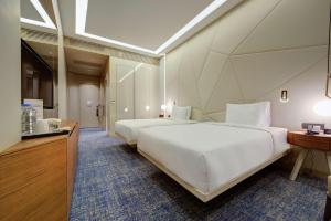 Postel nebo postele na pokoji v ubytování DoubleTree by Hilton Adana