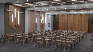 a large room with tables and chairs in it at DoubleTree by Hilton Manisa in Manisa