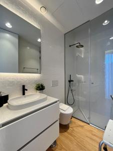 a bathroom with a tub and a toilet and a shower at Nomads Lux - 2BDR Almada Private Porto in Porto