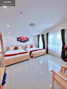 Postel nebo postele na pokoji v ubytování Ngoc Sang 3 Hotel