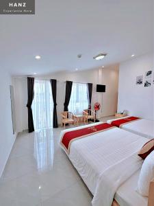 Postel nebo postele na pokoji v ubytování Ngoc Sang 3 Hotel