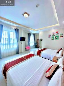 Postel nebo postele na pokoji v ubytování Ngoc Sang 3 Hotel